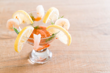 shrimp cocktail with sauce on tableの写真素材