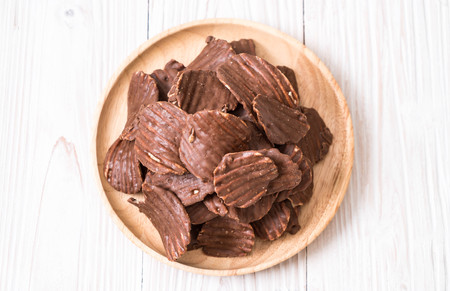 potato chips with chocolate on plateの写真素材