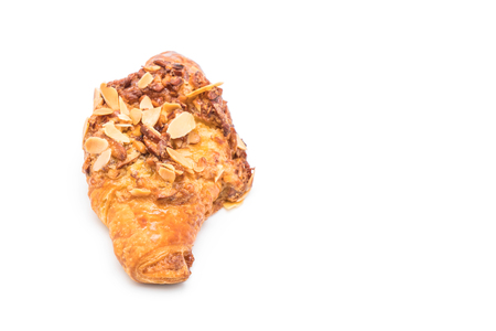 croissant with almonds isolated on white backgroundの写真素材