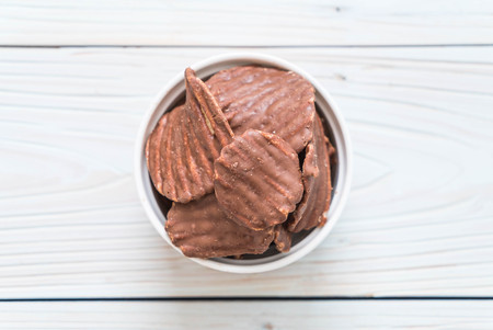 potato chips with chocolate on plateの写真素材
