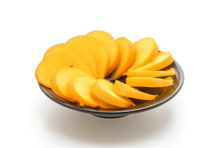 sliced fresh persimmon isolated on white backgroundの写真素材