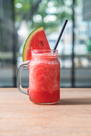watermelon smoothies jar on tableの写真素材