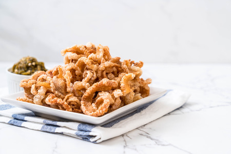 Fried pork rince or Pork snack with Nam Prik Num (Northern Thai Green Chilli Dip)