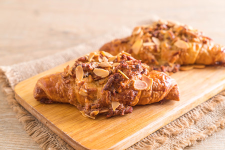 fresh baked croissant with almondsの写真素材