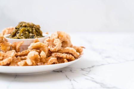 Fried pork rince or Pork snack with Nam Prik Num (Northern Thai Green Chilli Dip)の写真素材