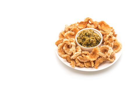 Fried pork rince or Pork snack with Nam Prik Num (Northern Thai Green Chilli Dip) isolated on white backgroundの写真素材