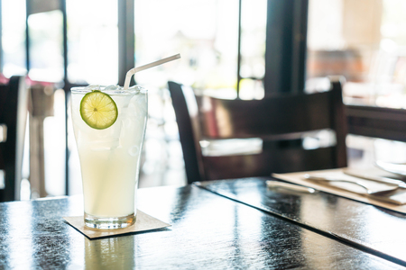 iced lemon soda glass in cafeの写真素材