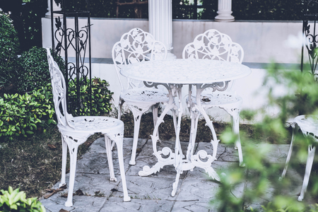 empty white outdoor patio table and chair - vintage filterの写真素材
