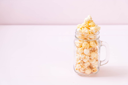 sweet popcorn on wood backgroundの写真素材