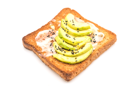 wholewheat bread toast with avocado isolated on white backgroundの写真素材
