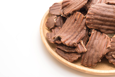 potato chips with chocolate isolated on white backgroundの写真素材