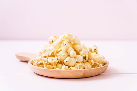 sweet popcorn on wood backgroundの写真素材
