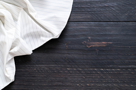 kitchen cloth (napkin) on wood background with copy space
