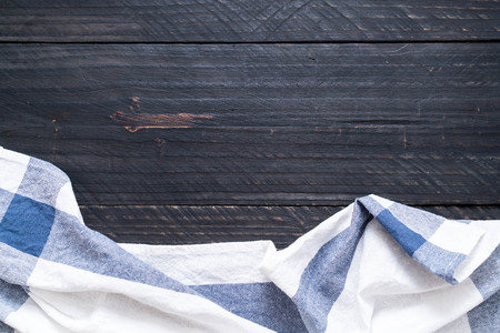 kitchen cloth (napkin) on wood background with copy space