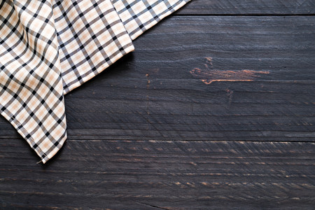 kitchen cloth (napkin) on wood background with copy spaceの写真素材