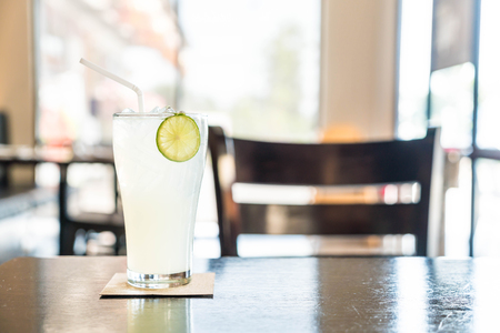 iced lemon soda glass in cafeの写真素材