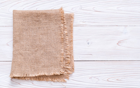kitchen cloth (napkin) on wood background with copy spaceの写真素材