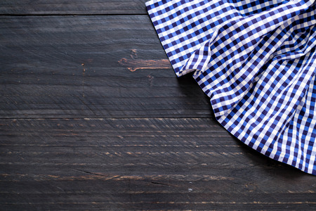 kitchen cloth (napkin) on wood background with copy space