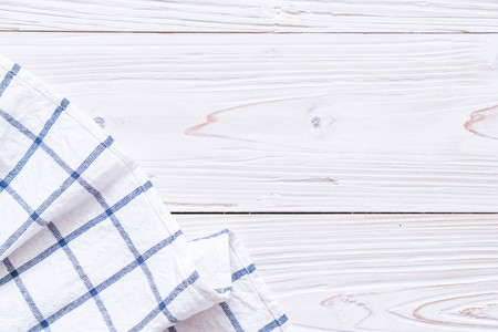 kitchen cloth (napkin) on wood background with copy space