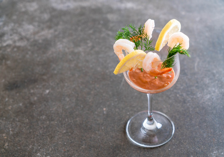 shrimp cocktail with sauce on tableの写真素材