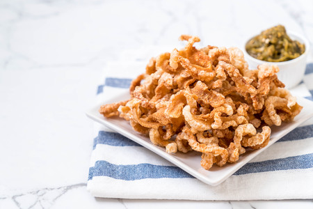 Fried pork rince or Pork snack with Nam Prik Num (Northern Thai Green Chilli Dip)の写真素材