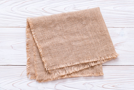 kitchen cloth (napkin) on wood background with copy spaceの写真素材