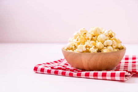 sweet popcorn on wood backgroundの写真素材