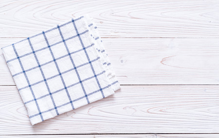 kitchen cloth (napkin) on wood background with copy spaceの写真素材