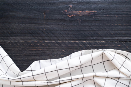 kitchen cloth (napkin) on wood background with copy spaceの写真素材