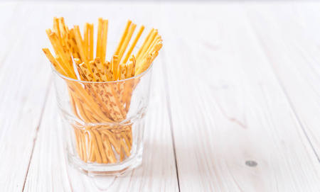 biscuit sticks on wood backgroundの写真素材