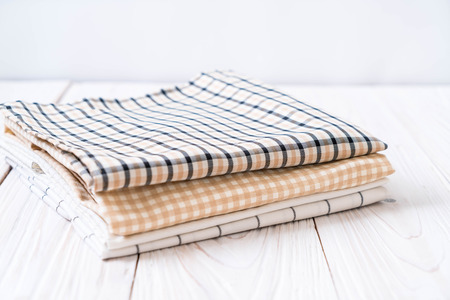 kitchen cloth (napkin) on wood background with copy space