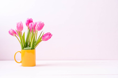 pink tulip flower on wood background with copy spaceの写真素材