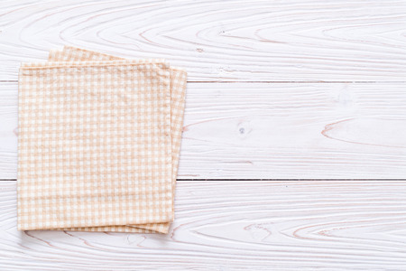 kitchen cloth (napkin) on wood background with copy spaceの写真素材