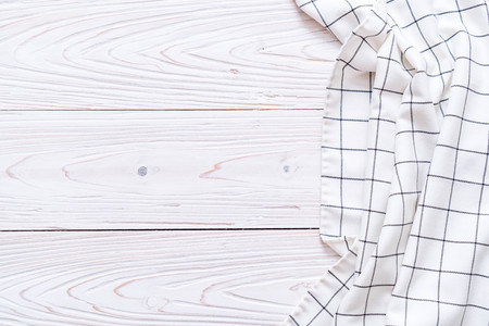 kitchen cloth (napkin) on wood background with copy spaceの写真素材
