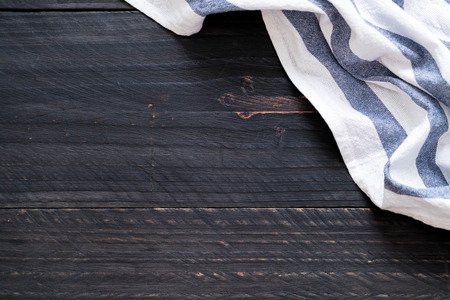 kitchen cloth (napkin) on wood background with copy space