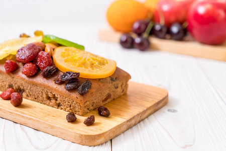 fruit cake on wood background