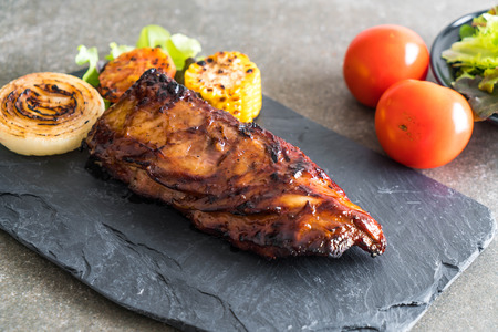 grilled pork ribs with barbrcue sauce and vegetableの写真素材