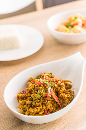 Stir Fried Minced Pork with Hot Yellow Curry Paste on plateの写真素材