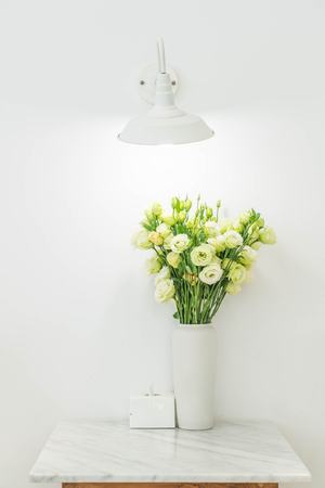 rose in vase decoration on tableの写真素材