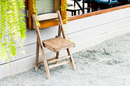 empty outdoor wooden chair on groundの写真素材