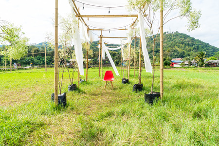 tent with white fabric on fieldの写真素材