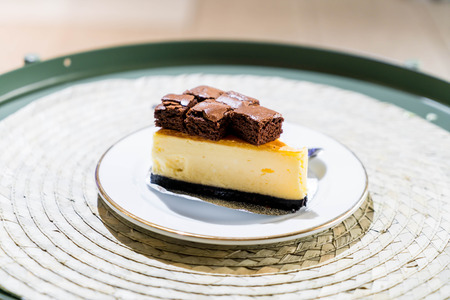 cheese cake with brownies on topの写真素材