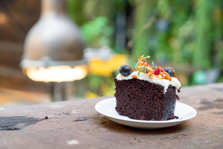 chocolate fruit cake with caramel on plateの写真素材