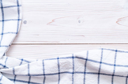 kitchen cloth (napkin) on wood background with copy space