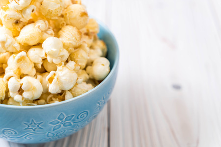 sweet popcorn on wood backgroundの写真素材