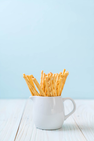 biscuit sticks on wood backgroundの写真素材