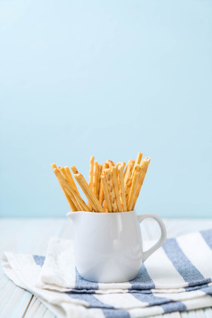 biscuit sticks on wood backgroundの写真素材