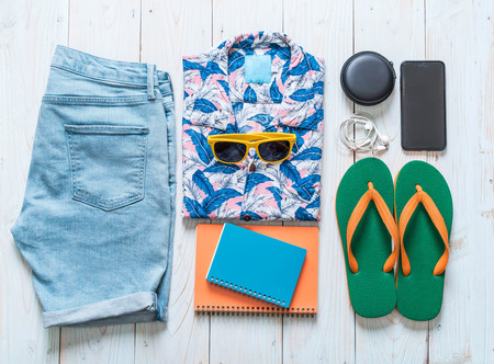 men's casual outfits of traveler, summer holiday on wood backgroundの写真素材