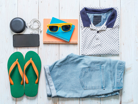 men's casual outfits of traveler, summer holiday on wood backgroundの写真素材