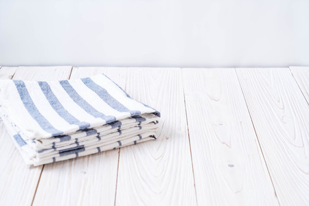 kitchen cloth (napkin) on wood background with copy spaceの写真素材